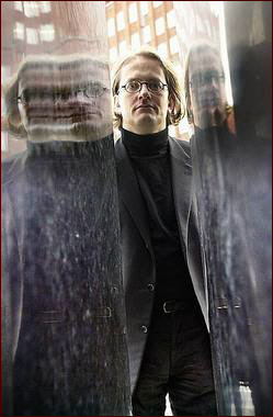 P&aring;l H. Christiansen mirrored in a metal sculpture